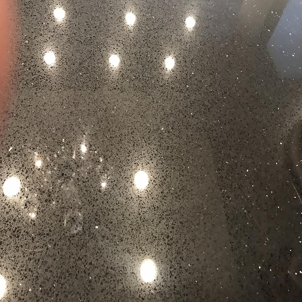 A polished and gleaming countertop reflecting light after a professional cleaning and sealing service in South Bay, CA.