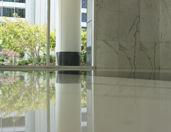 Shiny polished stone floor reflecting sunlight after professional stone polishing