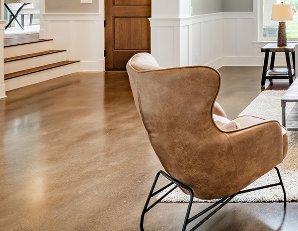 Restored stone floor in a modern living room after professional stone restoration services