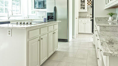 Clean and bright kitchen with tiled floor after professional tile and grout cleaning in Torrance, CA.